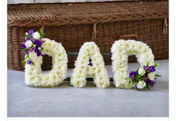 A beautiful fresh flower tribute, created to read the letters dad