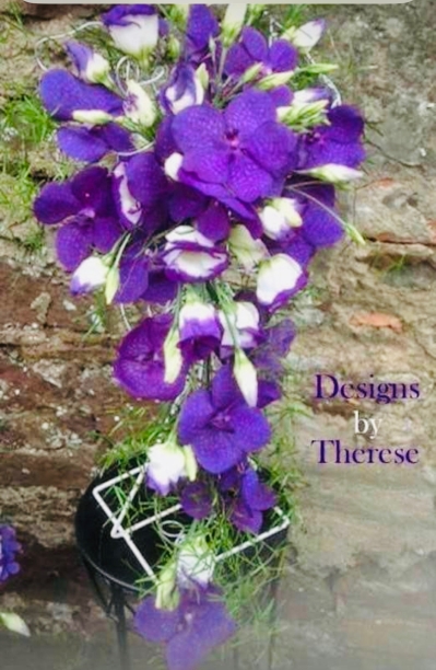 A stunning wedding bouquet of vanda orchids really beautiful in this very strong purple shade