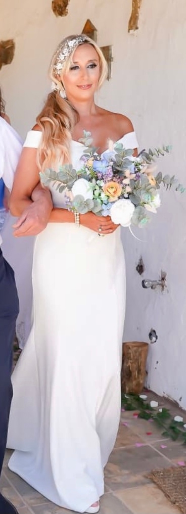 Faux flower wedding bouquet, created at designs by therese and brought to the wedding overseas