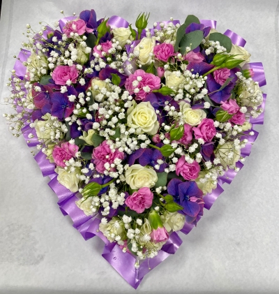 Heart shape funeral tribute, created with lilac and pink flowers, heart is 20cm in size a beautiful tribute