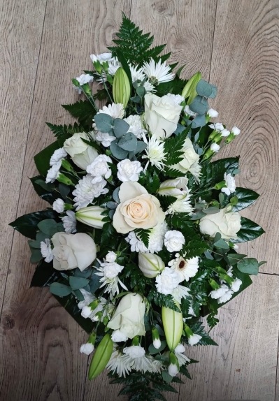 Retail fresh flowers spray with a selection of seasonal fresh white flowers and a selection of foliages