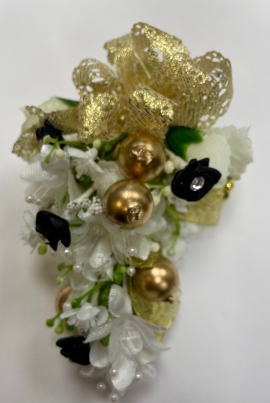 Wedding wristlet created with eith fresh or faux flowers and can be enhanced wit diamonds